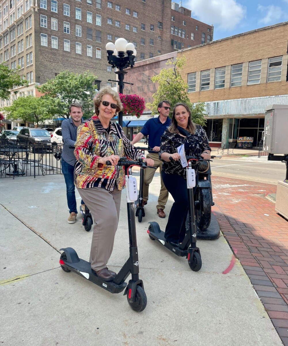 People riding e-scooters in Waterloo, Iowa