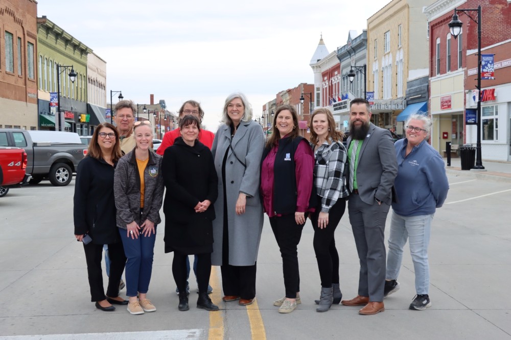 Main Street America staff and Nevada Main Street program staff pose in the middle of Main Street.