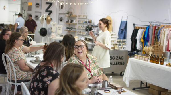 Women sit at tables during a Main Street training event