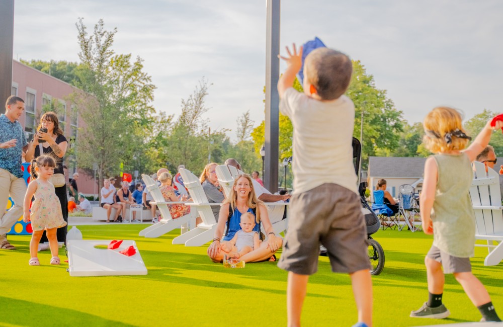 Kids playing lawn games on a sunny day