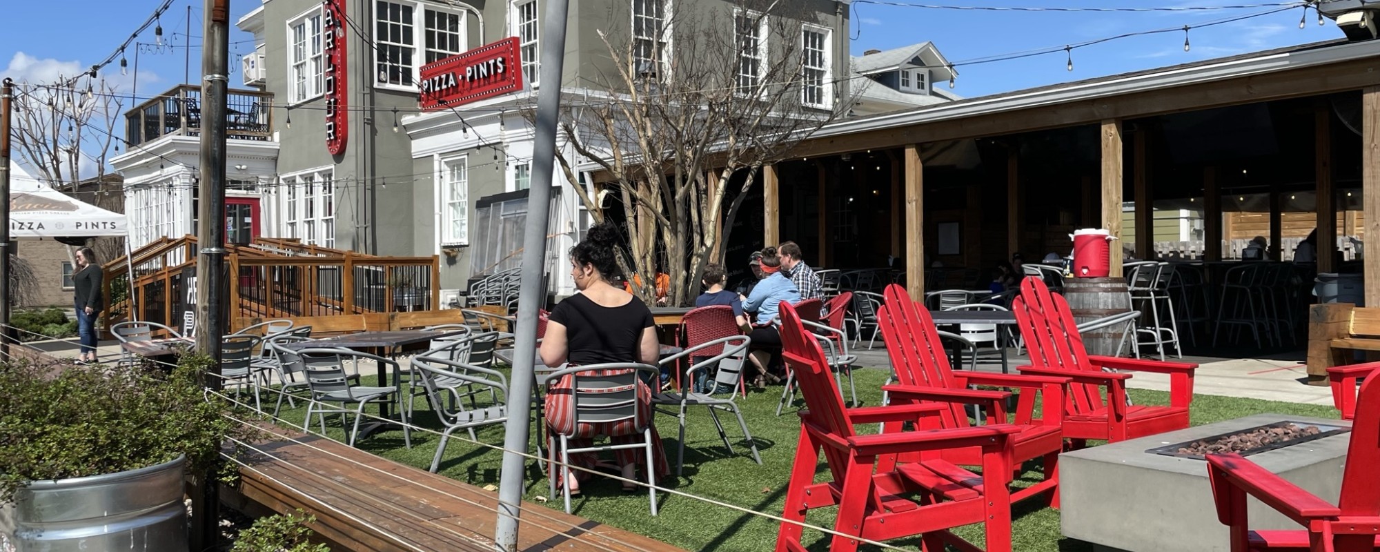 Parklet-style outdoor restaurant seating area.
