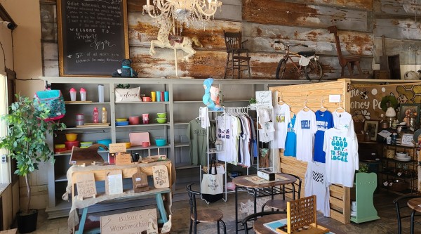 Small retail cubicles full of local goods in the corner of a coffee shop