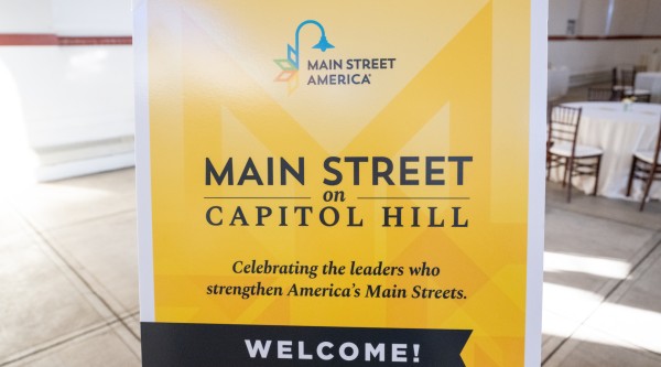 A sign reading "Main Street on Capitol Hill: Celebrating the leaders who strengthen America's Main Streets. Welcome!"