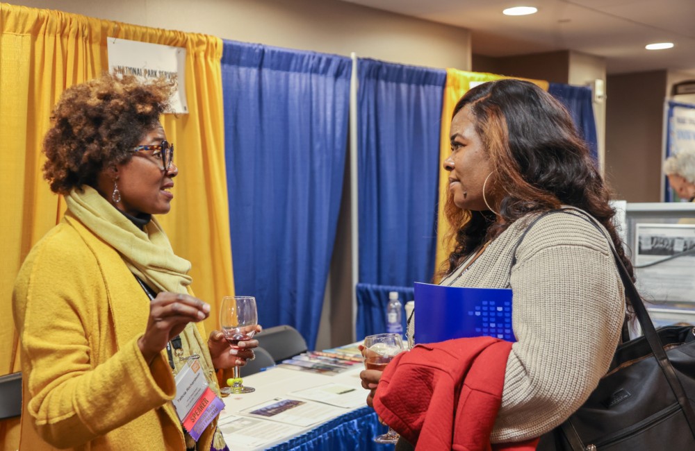 Two women engaged in conversation.