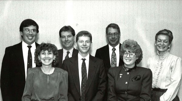 Black and white photo of a group of people accepting an award