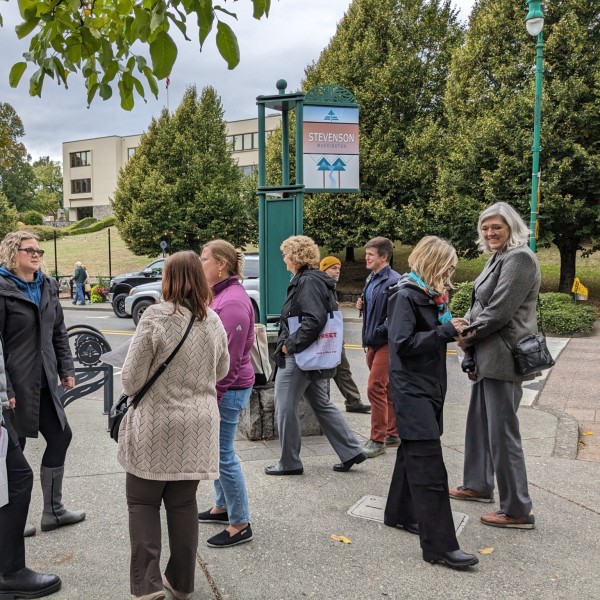 Main Street America staff and Main Street America Institute participants stand on a street corner in Stevenson, Washington.