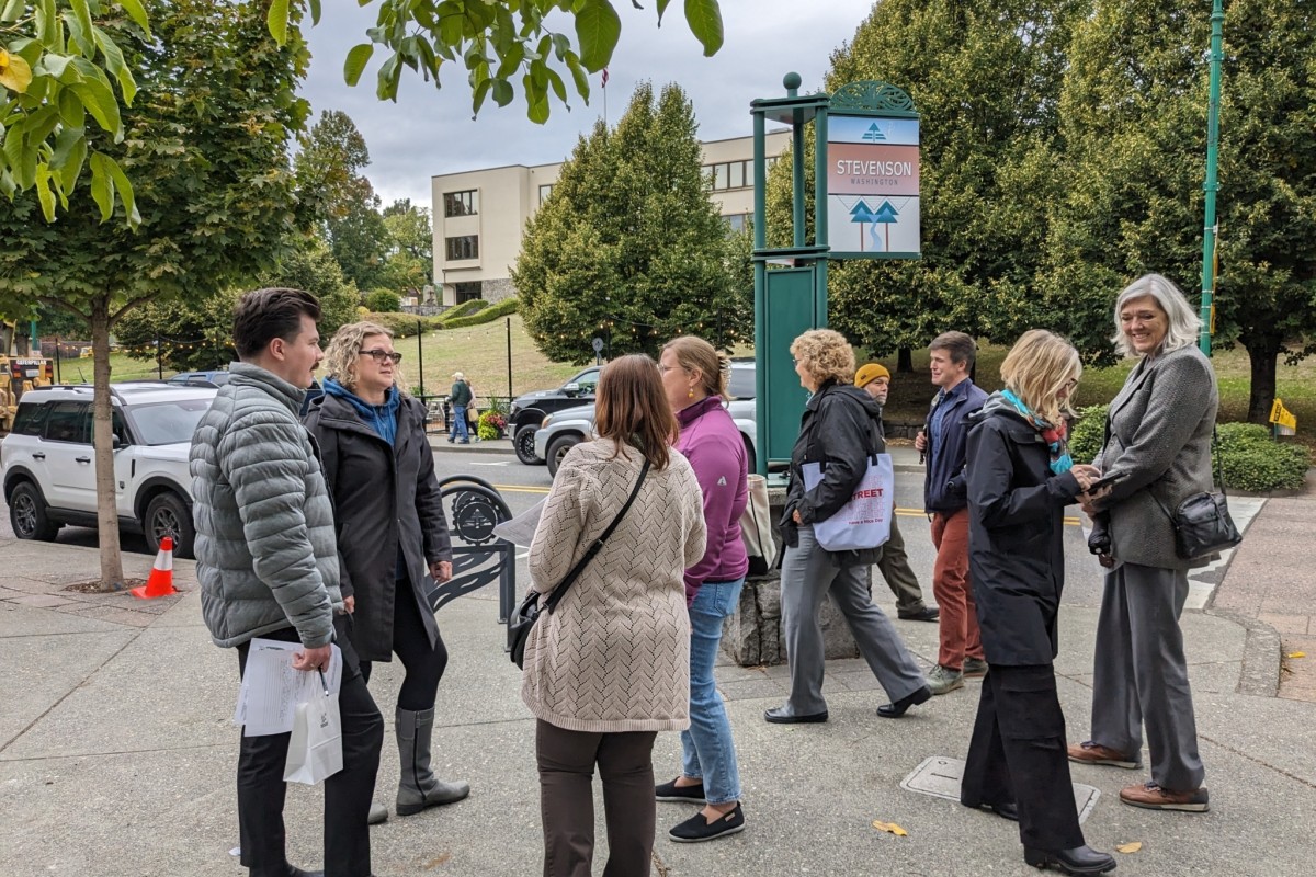 Main Street America staff and Main Street America Institute participants stand on a street corner in Stevenson, Washington.
