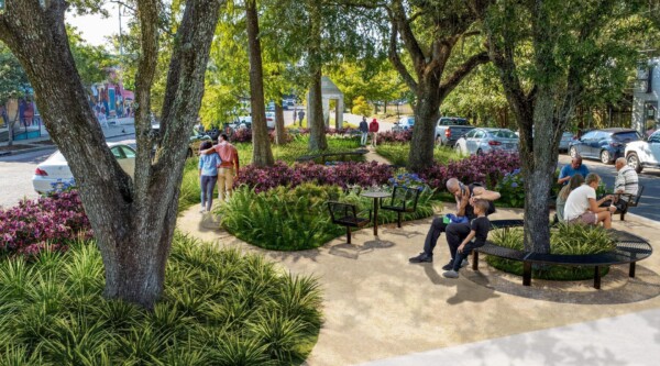 A park with lots of greenery, plants, and seating