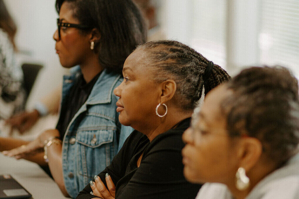 B3 community leaders and small business owners listening attentively to a presentation