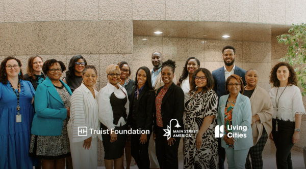 Group photo of B3 team partners, stakeholders, and small business owners in Charlotte, North Carolina with logo overlays for Truist Foundation, Main Street America, and Living Cities