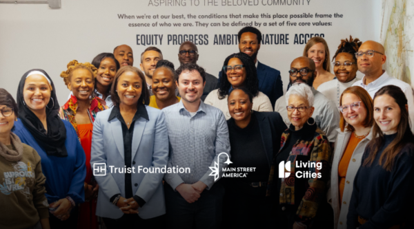 Breaking Barriers to Business (B3) team and stakeholders smiling at camera in building in Atlanta, Georgia