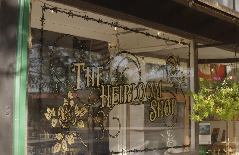 Photo of The Heirloom Shop window, a small business in Raton, New Mexico.